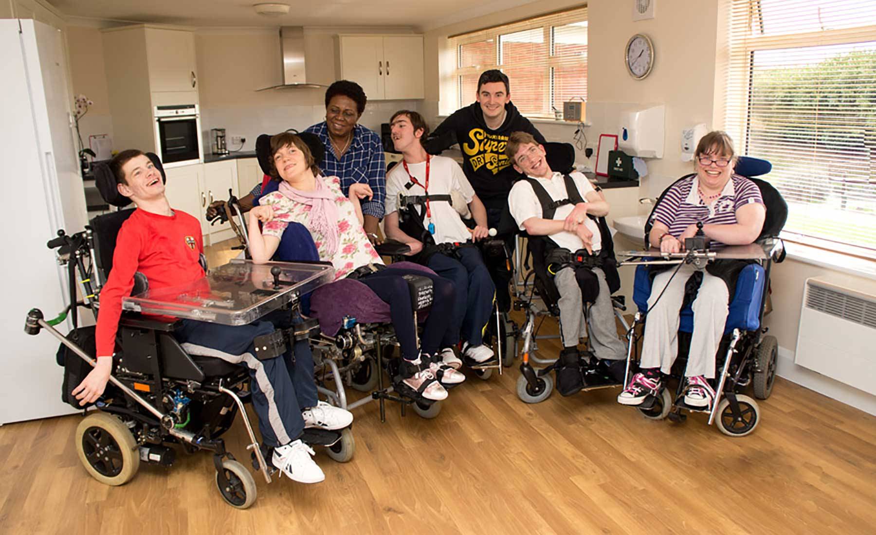 Young adults with disabilities taking part in a group wheelchair training session